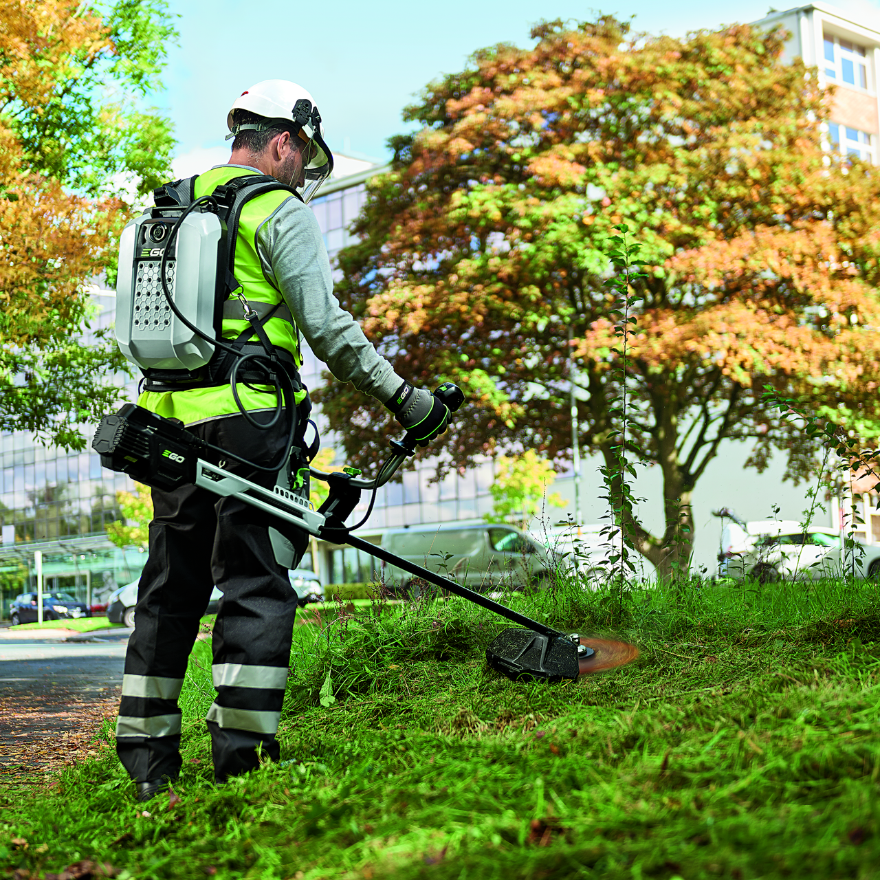 Man uses EGO line trimmer